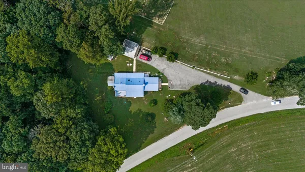an aerial view of a golf course with chairs