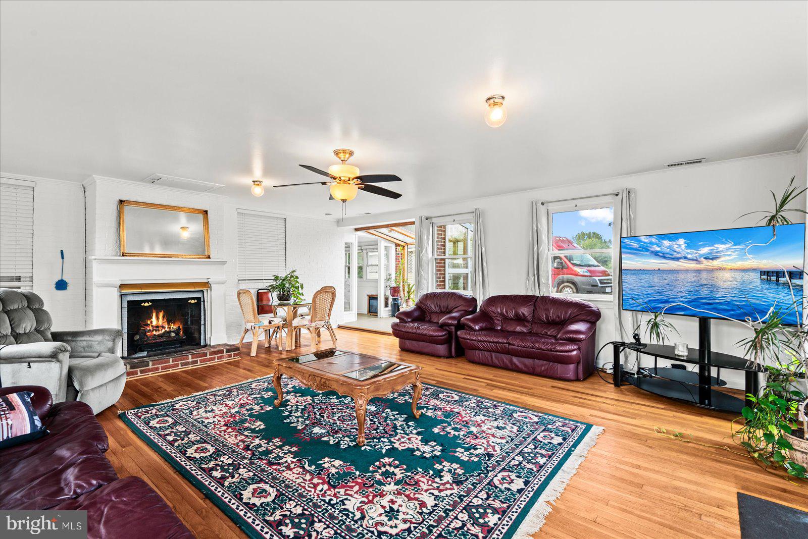 2931 Vawter Corner Road Louisa, VA 23093 - Photo 4 of 47 a living room with furniture a rug and a fireplace