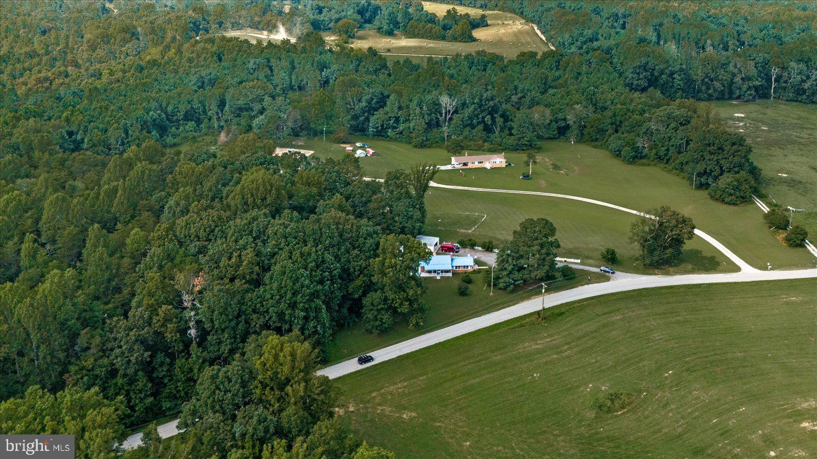 2931 Vawter Corner Road Louisa, VA 23093 - Photo 41 of 47 an aerial view of a house a yard and lake view