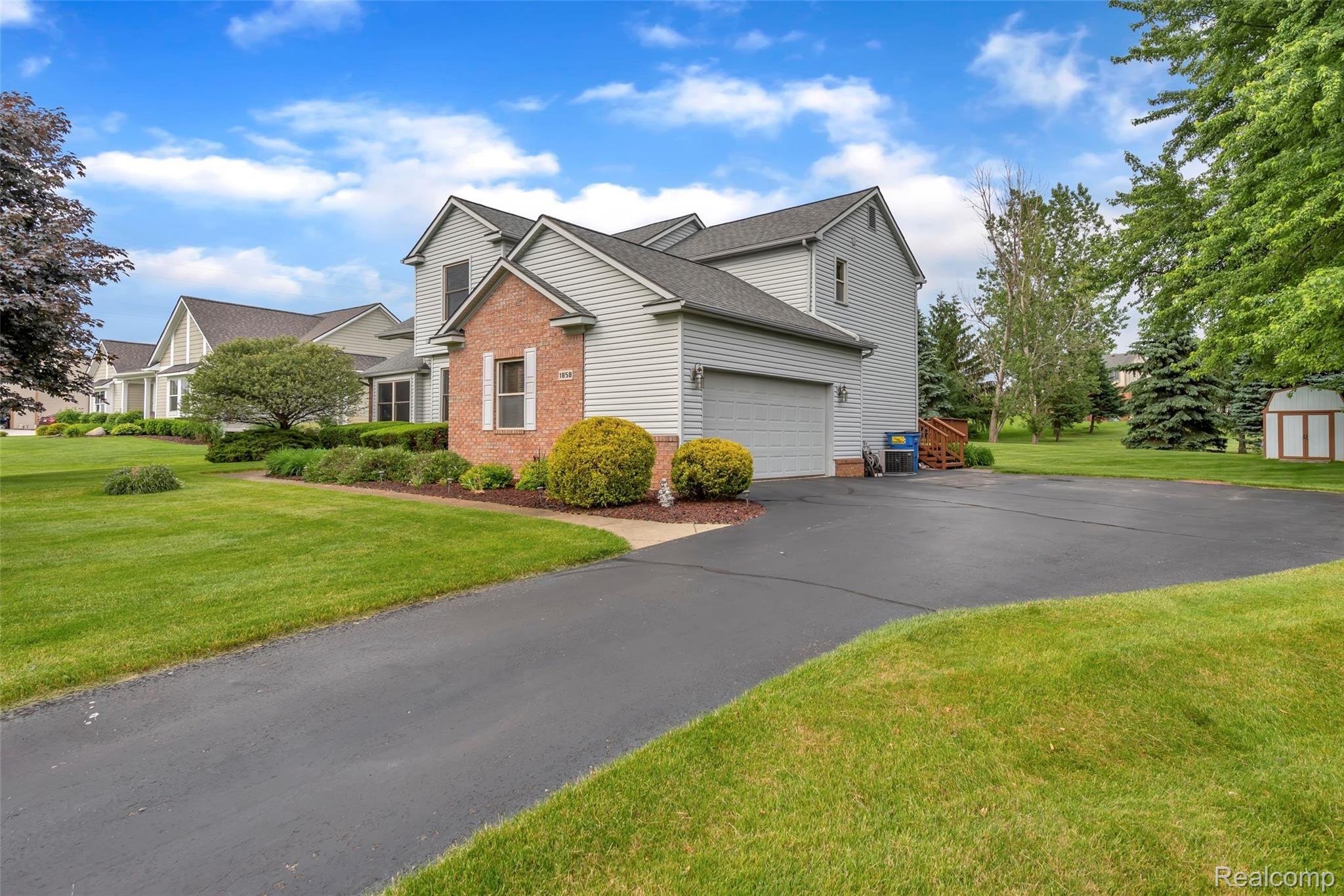 1858 Park Ridge Court Howell, MI 48843 - Photo 3 of 44 Driveway with extra parking