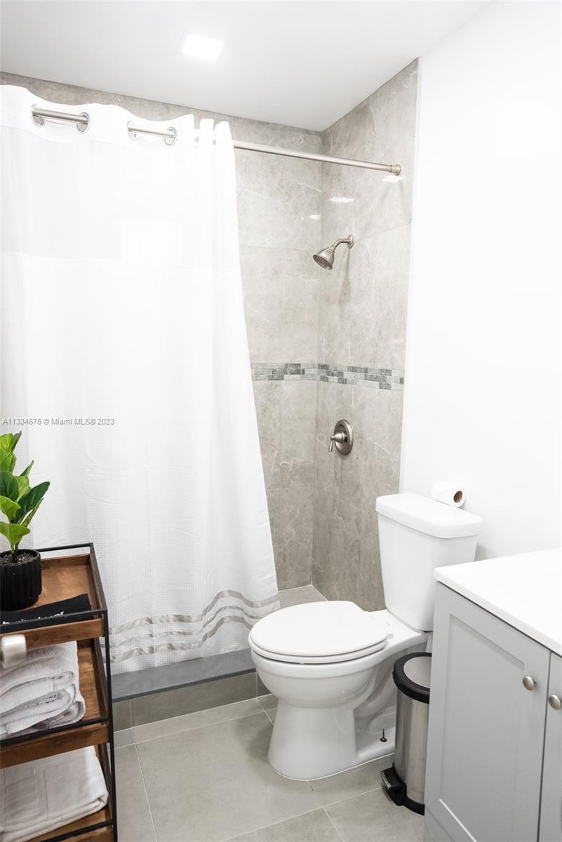 520 Northwest 45th Street, Unit 1 Miami, FL 33127 - Photo 7 of 7 a bathroom with a toilet and a shower