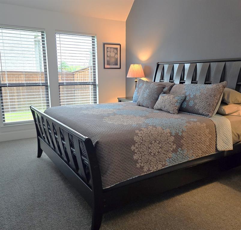 1620 Ripasso Way McLendon-Chisholm, TX 75032 - Photo 11 of 40 a bed sitting in a bedroom next to a window