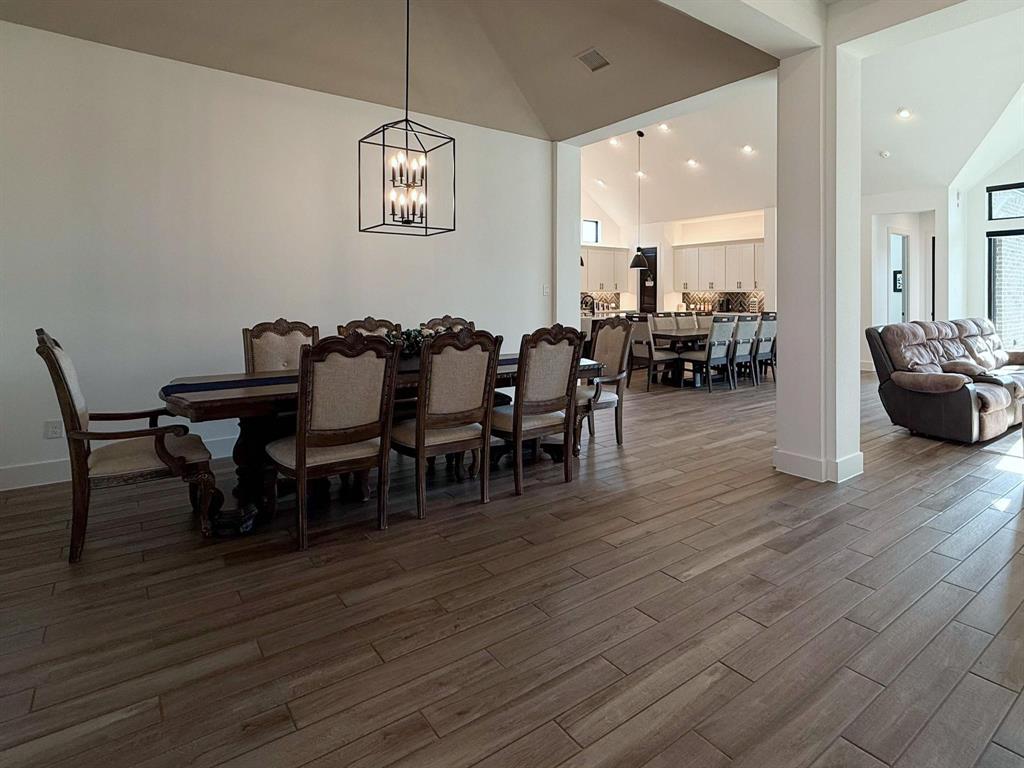 1620 Ripasso Way McLendon-Chisholm, TX 75032 - Photo 15 of 40 a view of a dining room with furniture and wooden floor