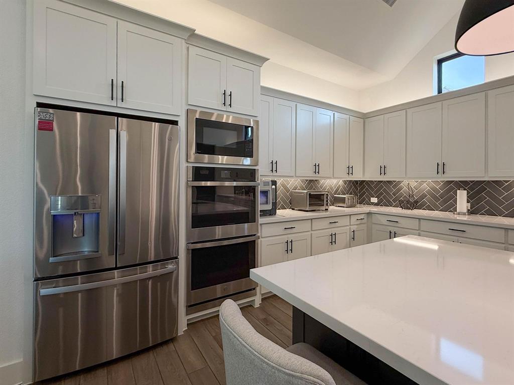 1620 Ripasso Way McLendon-Chisholm, TX 75032 - Photo 17 of 40 a kitchen with a sink stainless steel appliances and cabinets