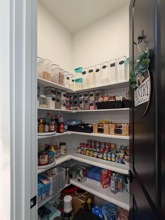 1620 Ripasso Way McLendon-Chisholm, TX 75032 - Photo 20 of 40 a room with granite countertop lots of different kinds of food