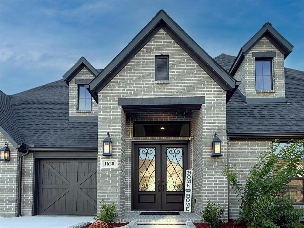 1620 Ripasso Way McLendon-Chisholm, TX 75032 - Photo 2 of 40 a front view of a house with glass windows and yard