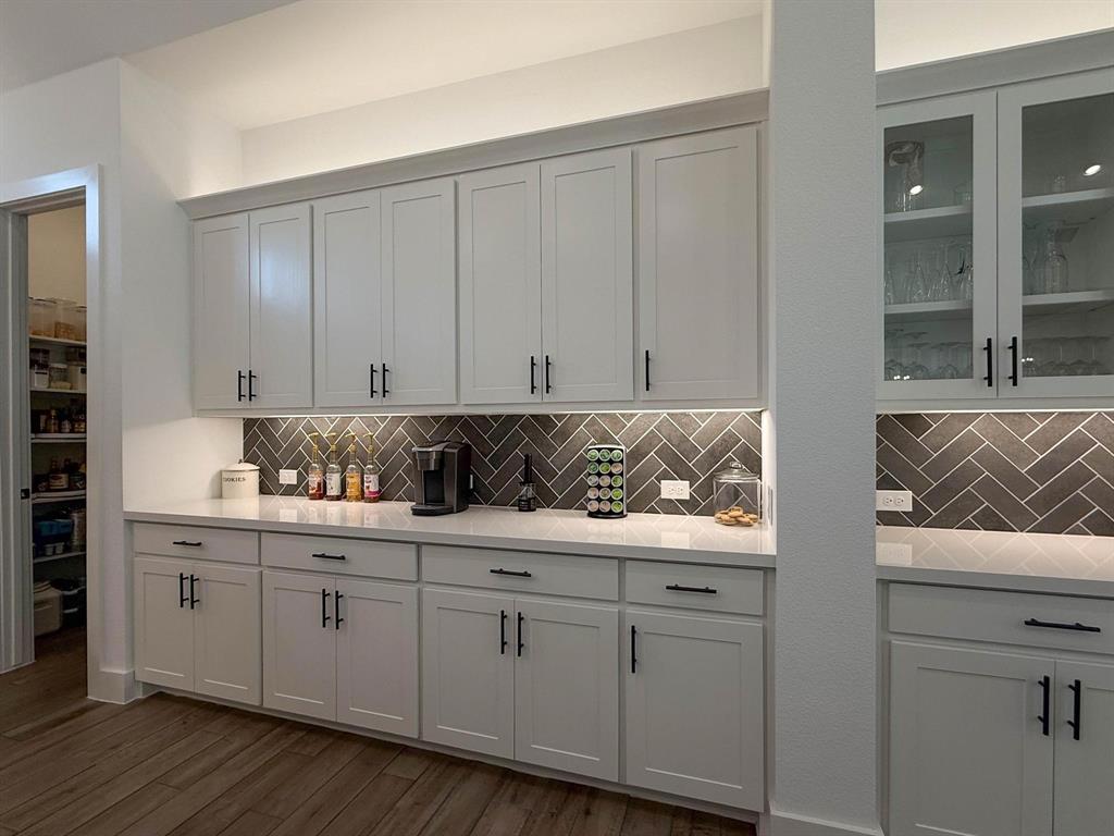 1620 Ripasso Way McLendon-Chisholm, TX 75032 - Photo 21 of 40 a kitchen with white cabinets and sink