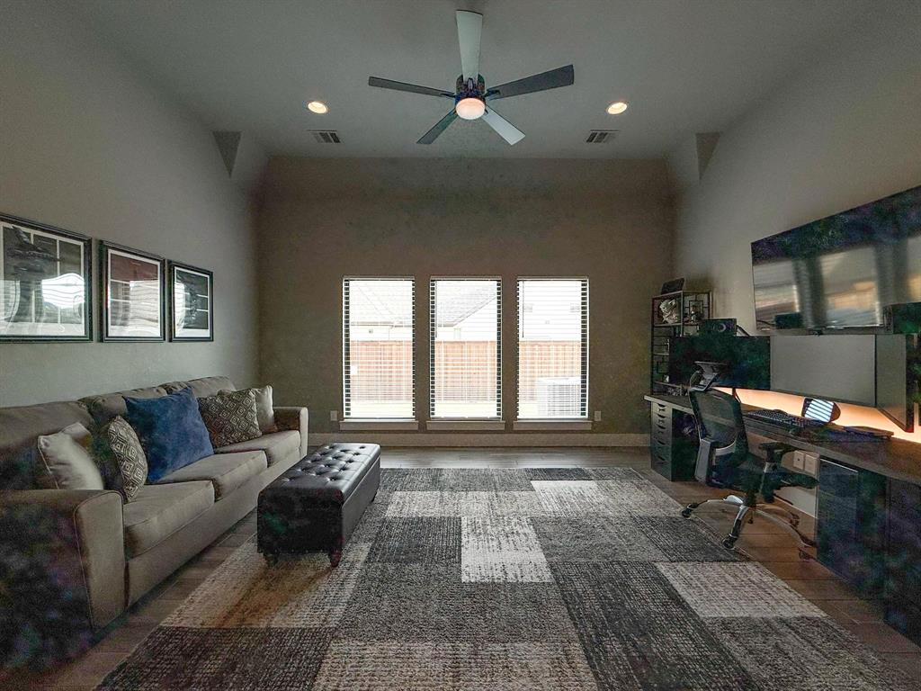 1620 Ripasso Way McLendon-Chisholm, TX 75032 - Photo 36 of 40 a living room with furniture and a fireplace
