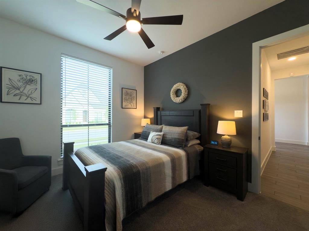 1620 Ripasso Way McLendon-Chisholm, TX 75032 - Photo 9 of 40 a bedroom with a bed and a chandelier