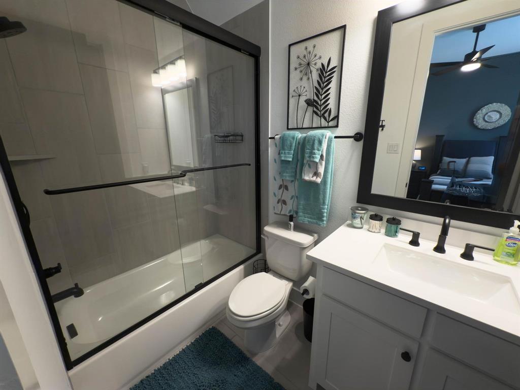 1620 Ripasso Way McLendon-Chisholm, TX 75032 - Photo 10 of 40 a bathroom with a sink a toilet and shower