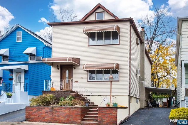 a front view of a house with garage
