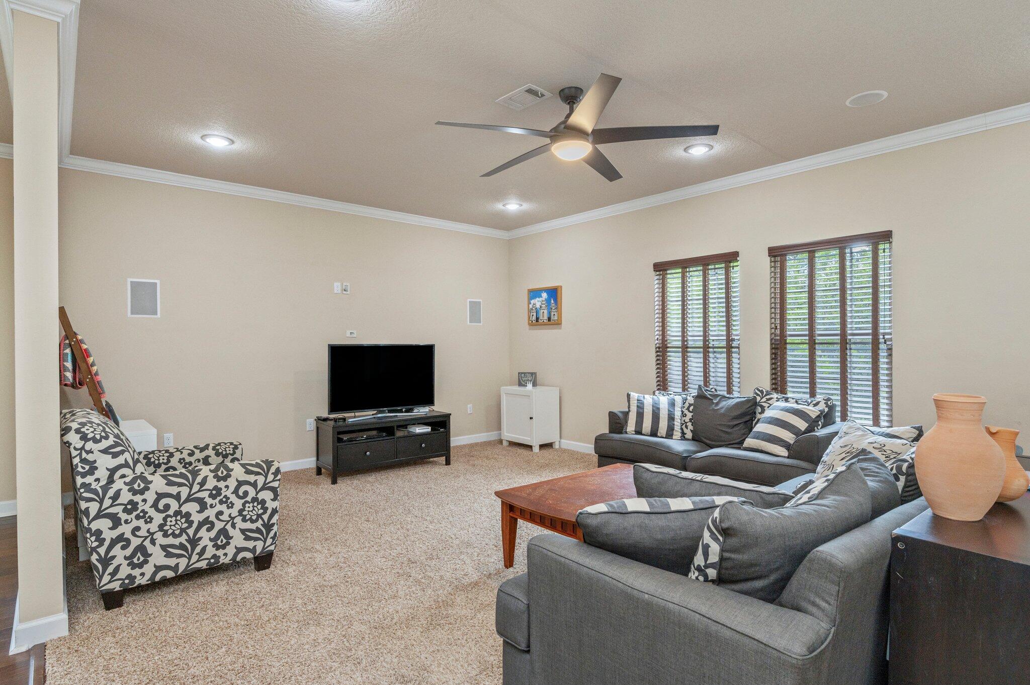 4558 Hermosa Road Crestview, FL 32539 - Photo 11 of 48 a living room with furniture and a flat screen tv