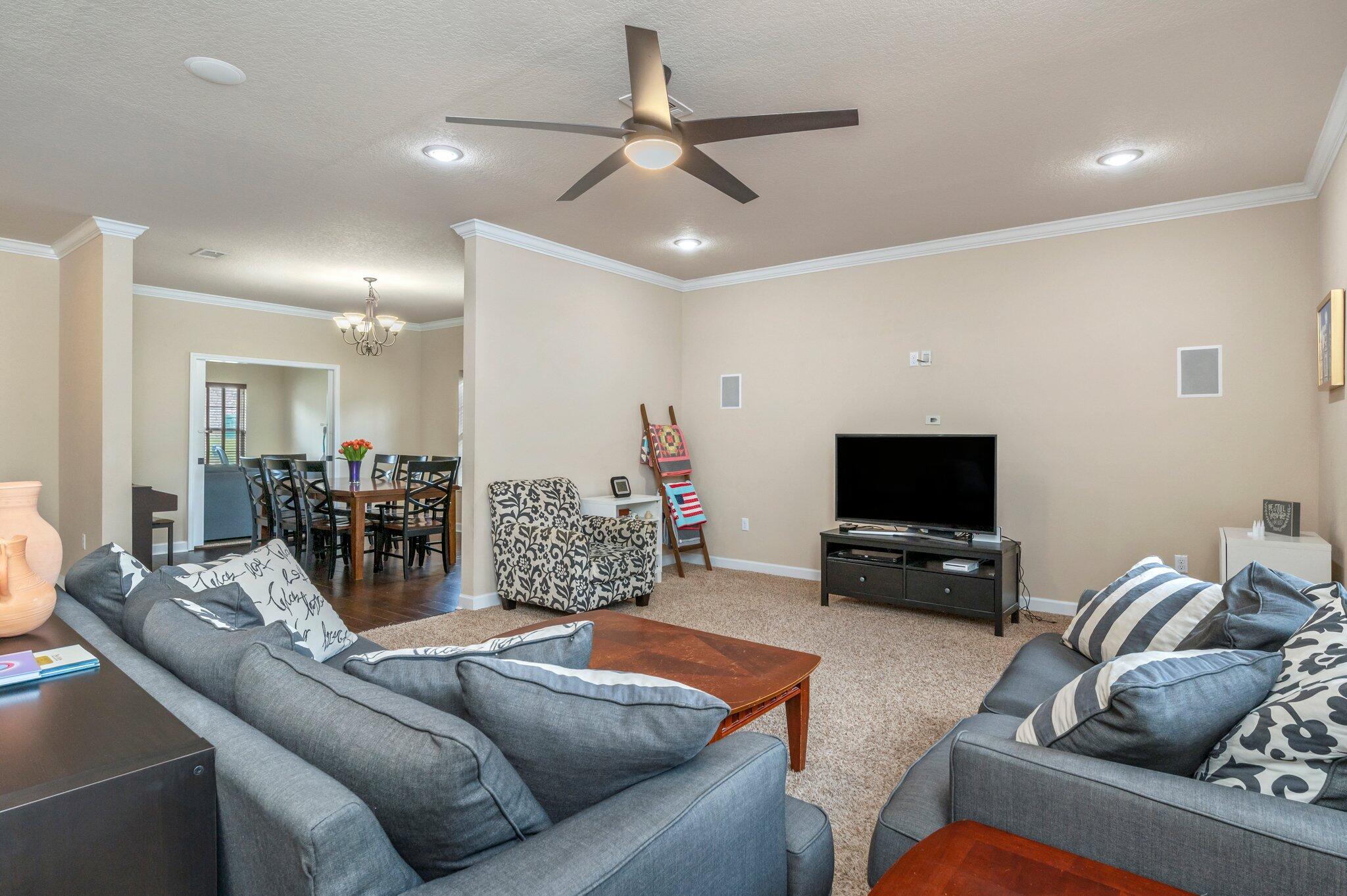 4558 Hermosa Road Crestview, FL 32539 - Photo 15 of 48 a living room with furniture and a flat screen tv