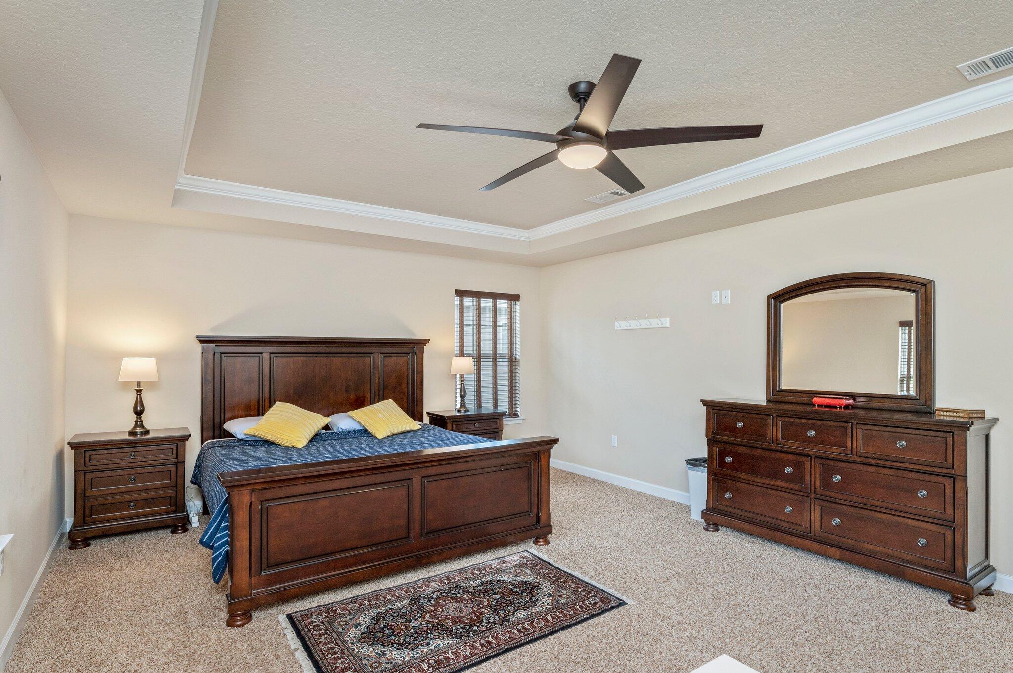 4558 Hermosa Road Crestview, FL 32539 - Photo 24 of 48 a bedroom with a bed and a dresser
