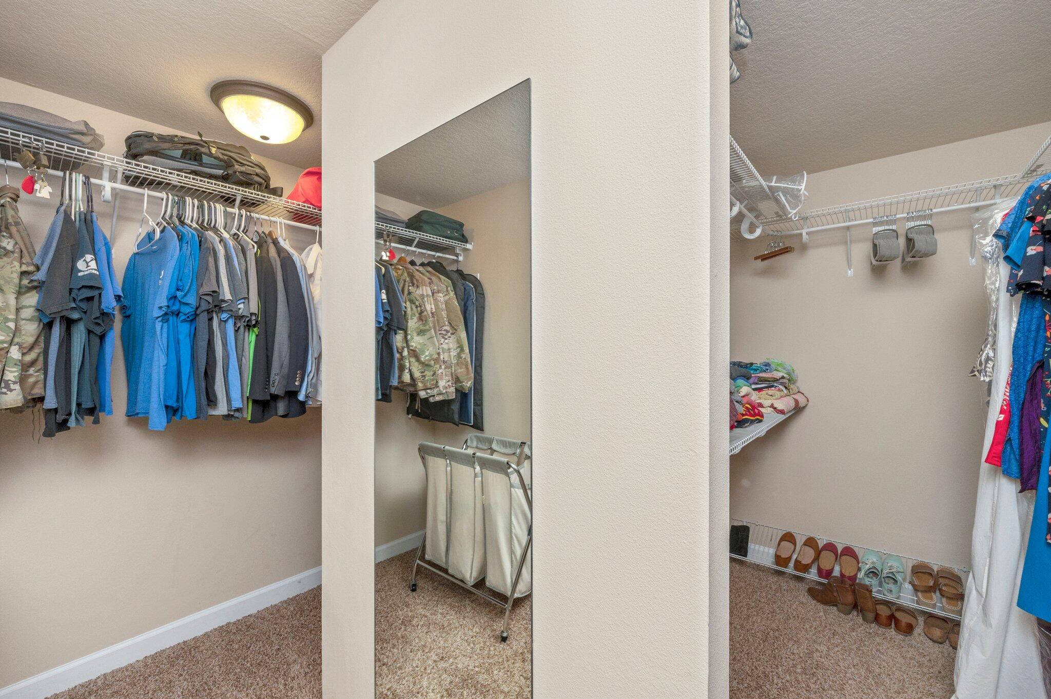 4558 Hermosa Road Crestview, FL 32539 - Photo 31 of 48 a view of walk in closet with clothes and shoes