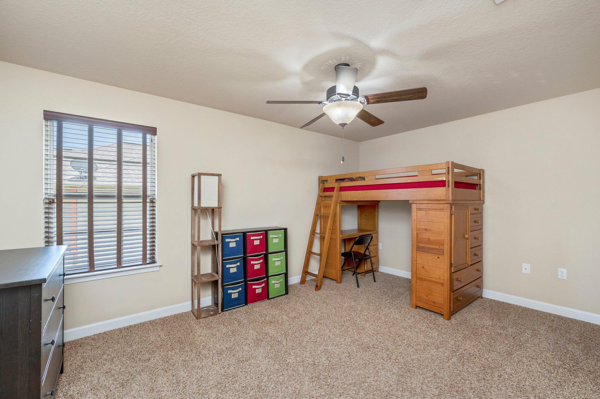 4558 Hermosa Road Crestview, FL 32539 - Photo 33 of 48 a view of a room with toys and a ceiling fan