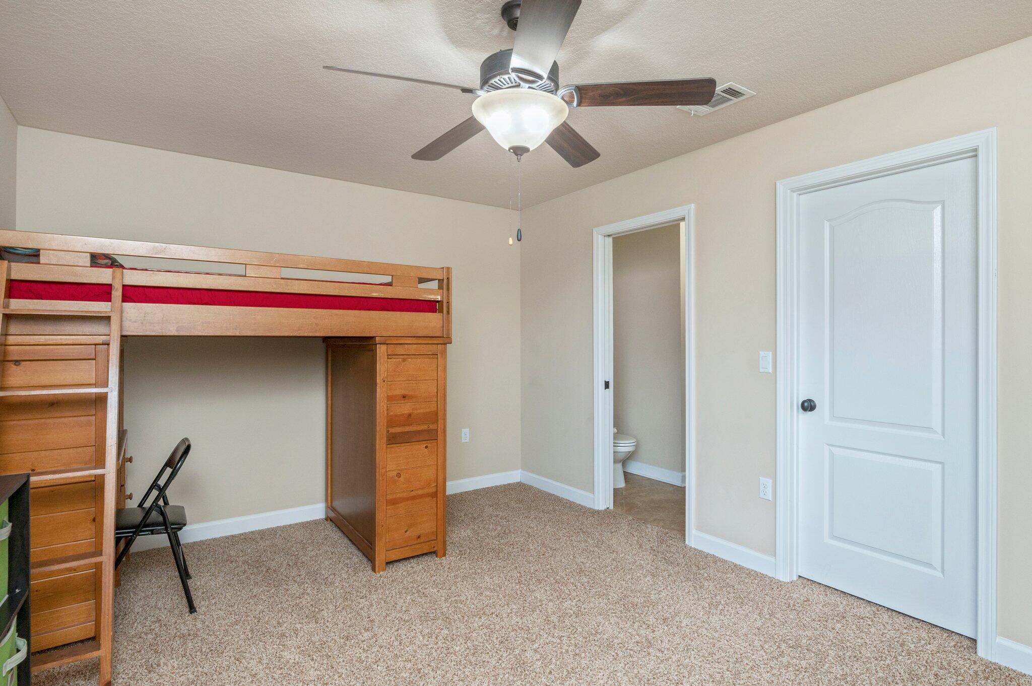 4558 Hermosa Road Crestview, FL 32539 - Photo 34 of 48 a view of room with workspace and a ceiling fan