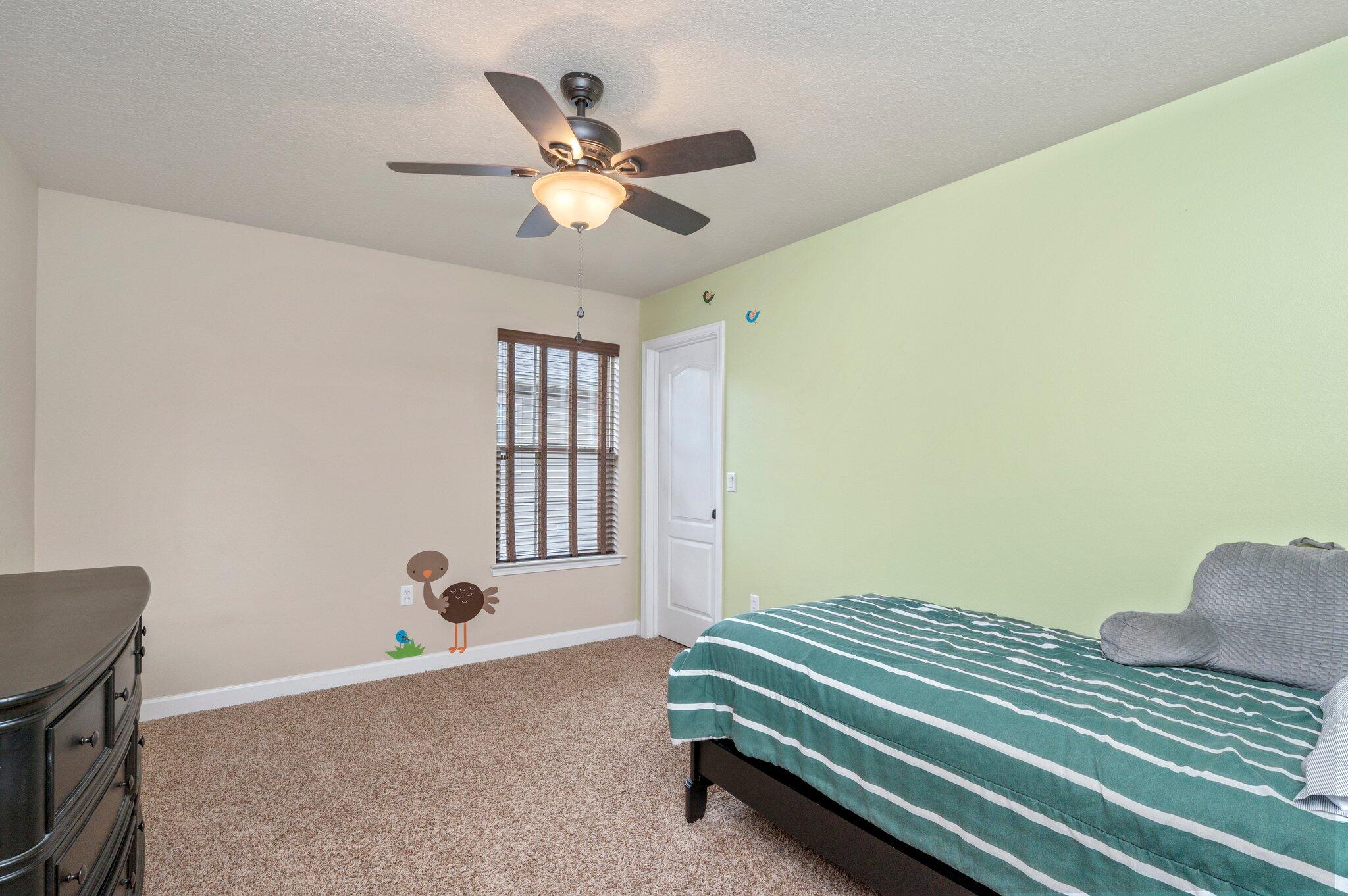 4558 Hermosa Road Crestview, FL 32539 - Photo 39 of 48 a bedroom with a bed and a chandelier