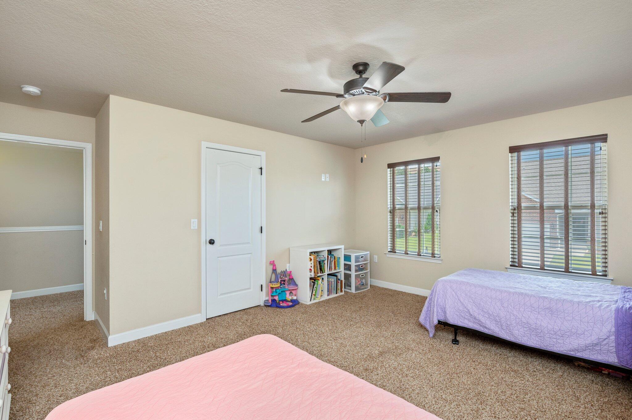 4558 Hermosa Road Crestview, FL 32539 - Photo 42 of 48 a bedroom with a bed and a chandelier