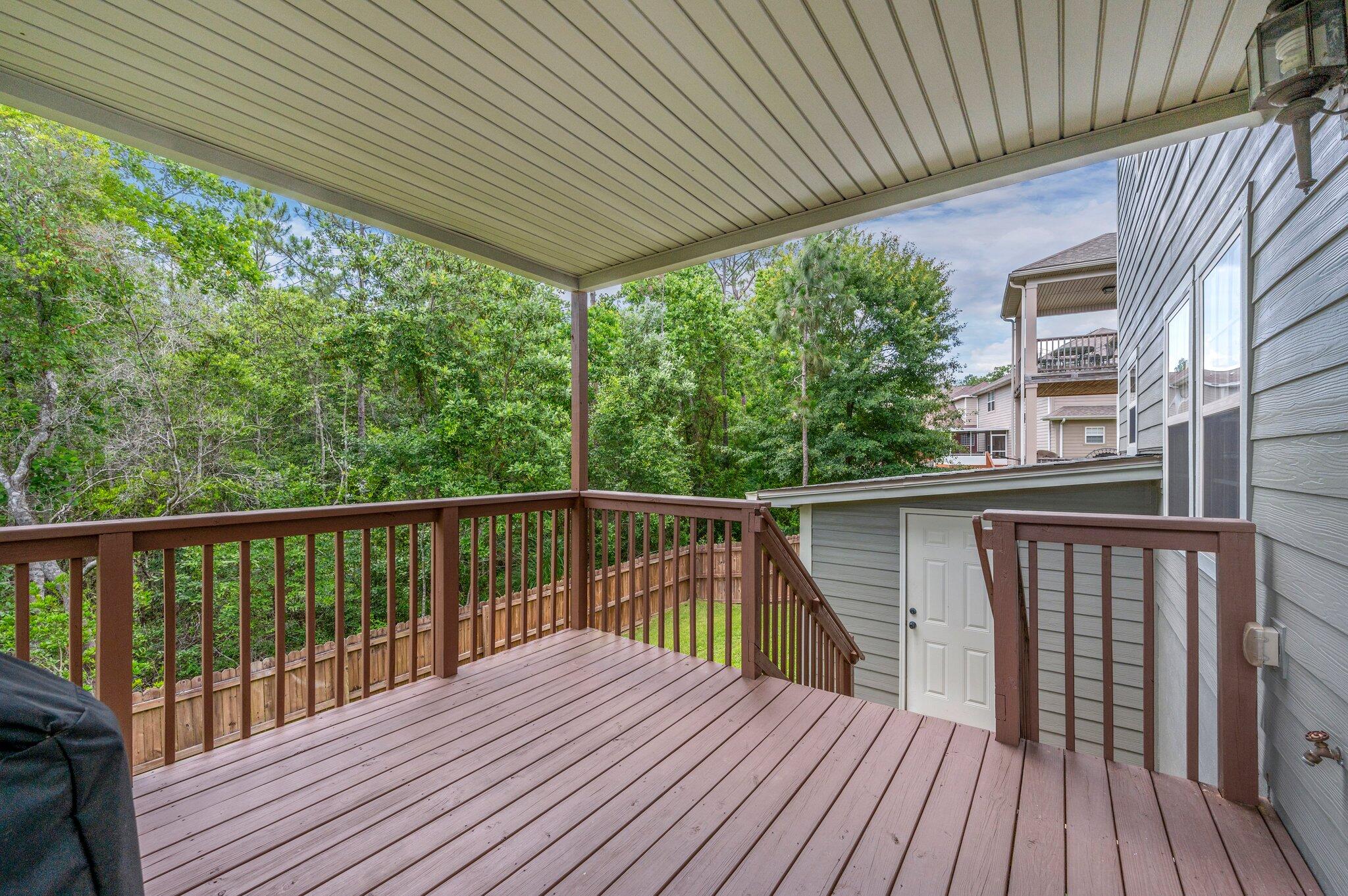 4558 Hermosa Road Crestview, FL 32539 - Photo 45 of 48 a balcony with wooden floor and outdoor space