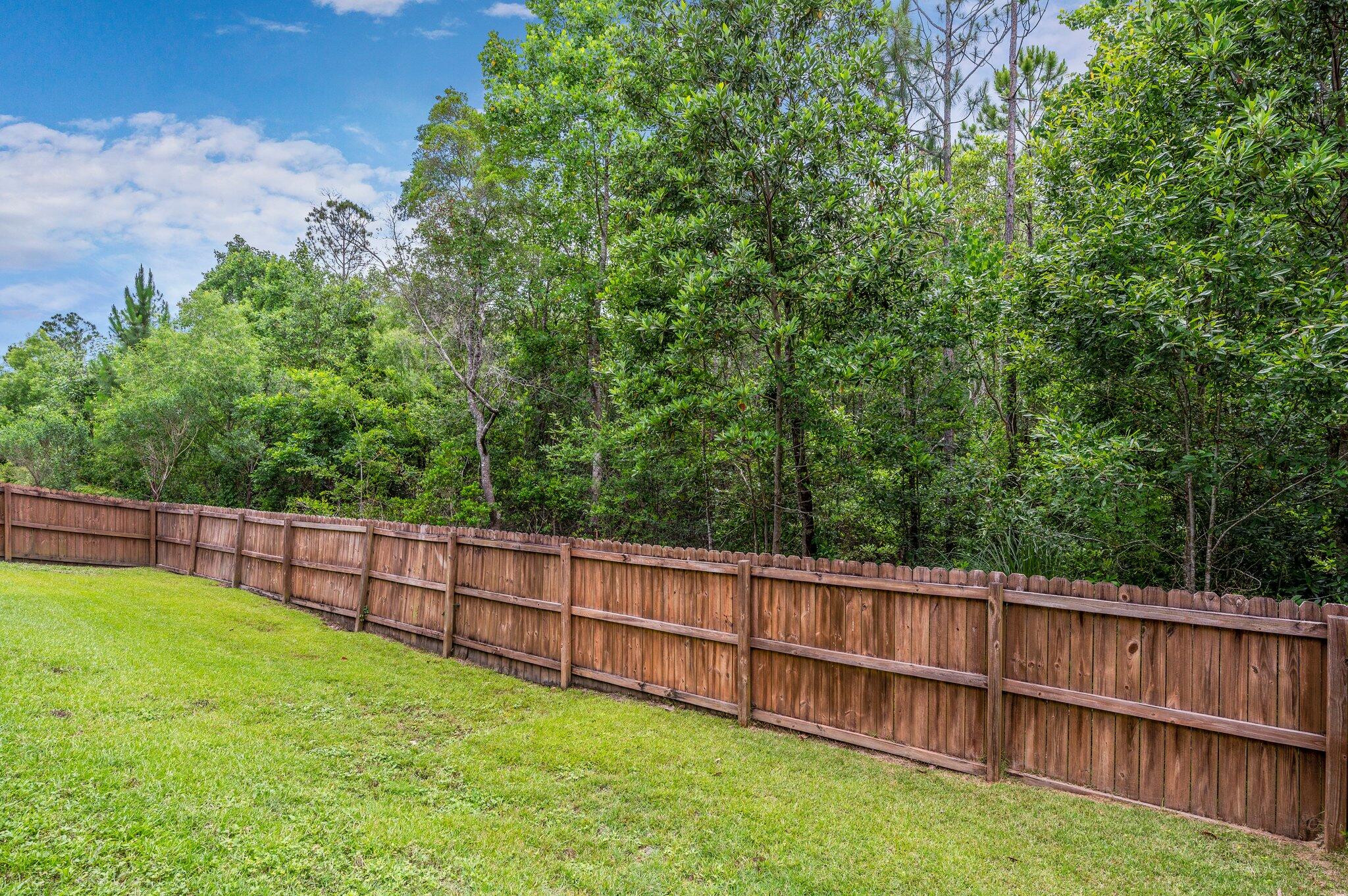 4558 Hermosa Road Crestview, FL 32539 - Photo 46 of 48 a view of a backyard with a wooden fence