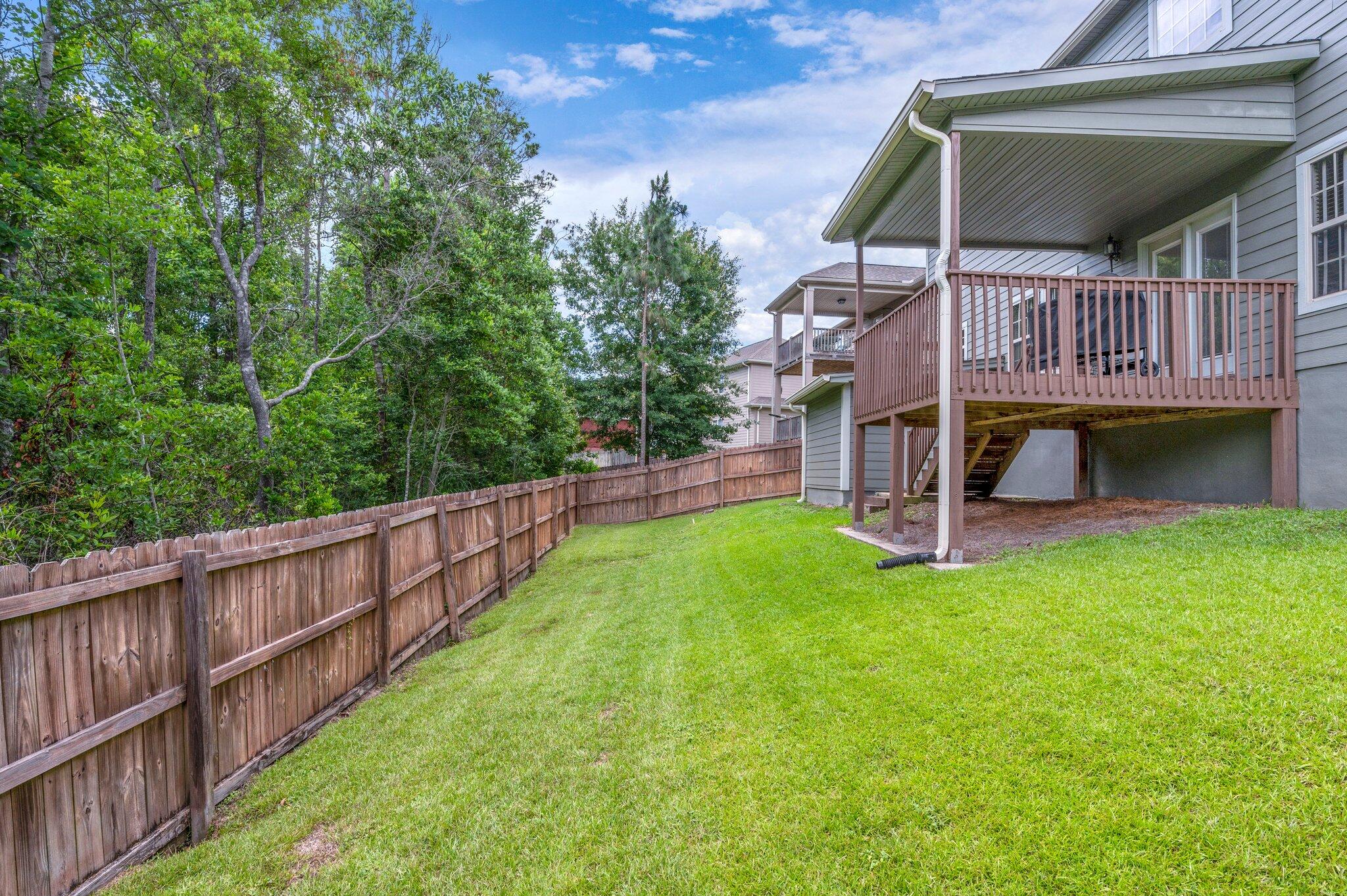 4558 Hermosa Road Crestview, FL 32539 - Photo 48 of 48 a view of yard with swimming pool and deck
