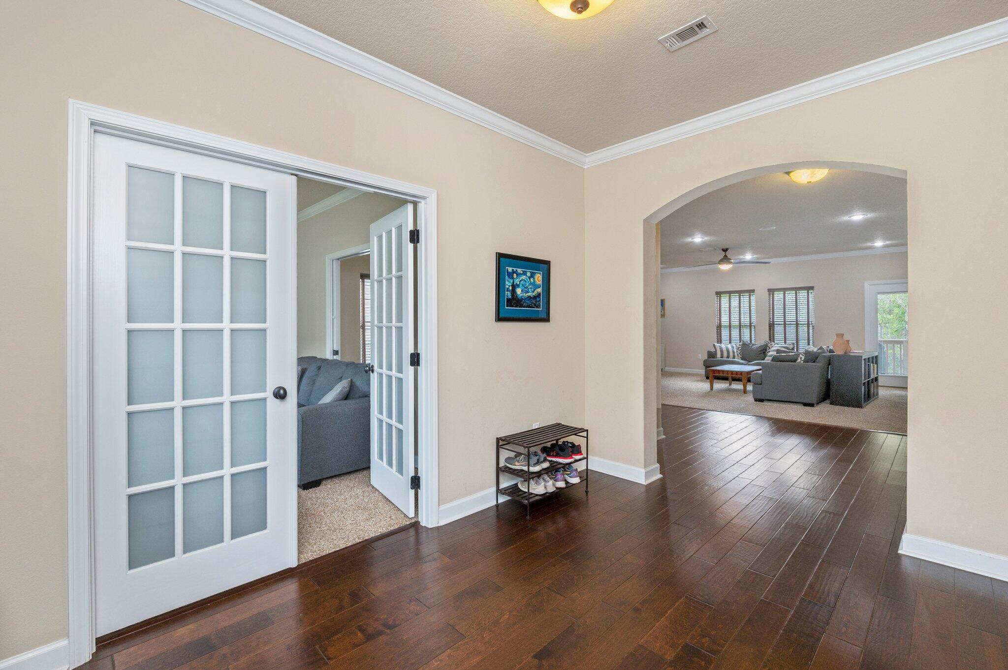 4558 Hermosa Road Crestview, FL 32539 - Photo 6 of 48 a view of a livingroom with wooden floor and furniture