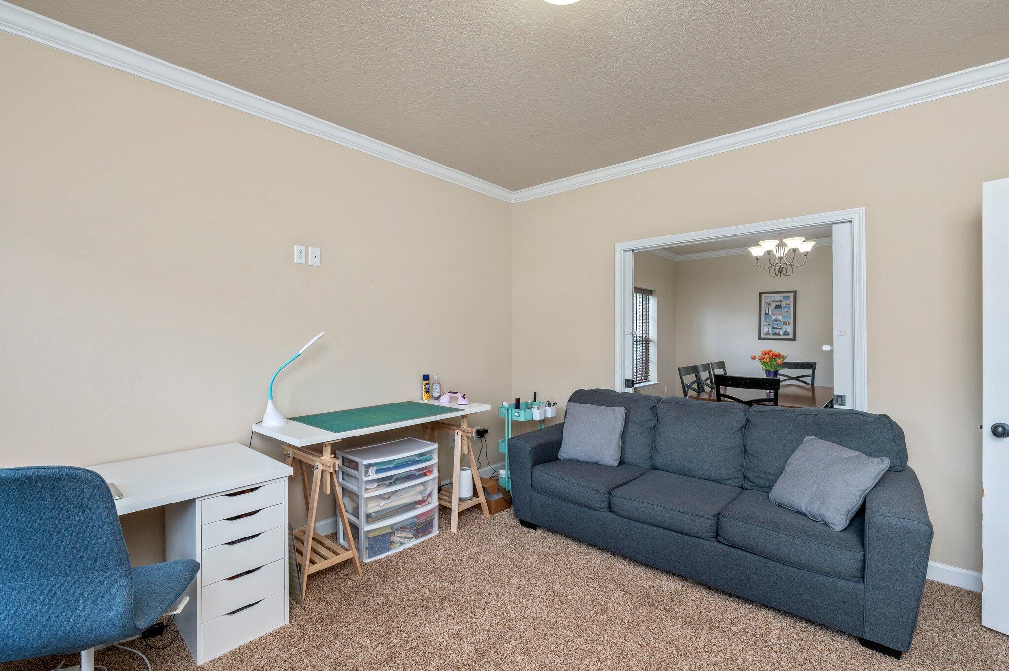 4558 Hermosa Road Crestview, FL 32539 - Photo 7 of 48 a living room with furniture and a dining table