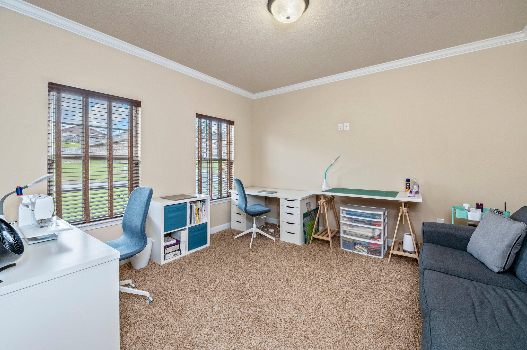 4558 Hermosa Road Crestview, FL 32539 - Photo 8 of 48 a view of a livingroom with furniture and windows