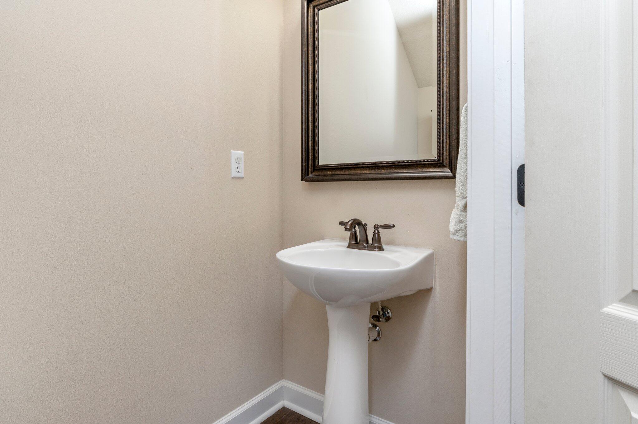 4558 Hermosa Road Crestview, FL 32539 - Photo 9 of 48 a bathroom with a sink and a mirror