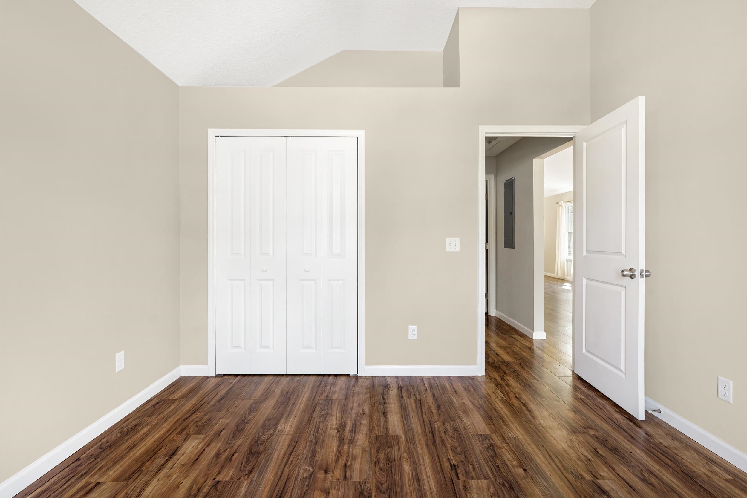 231 Majorca Road St. Augustine, FL 32080 - Photo 12 of 33 an empty room with wooden floor and windows