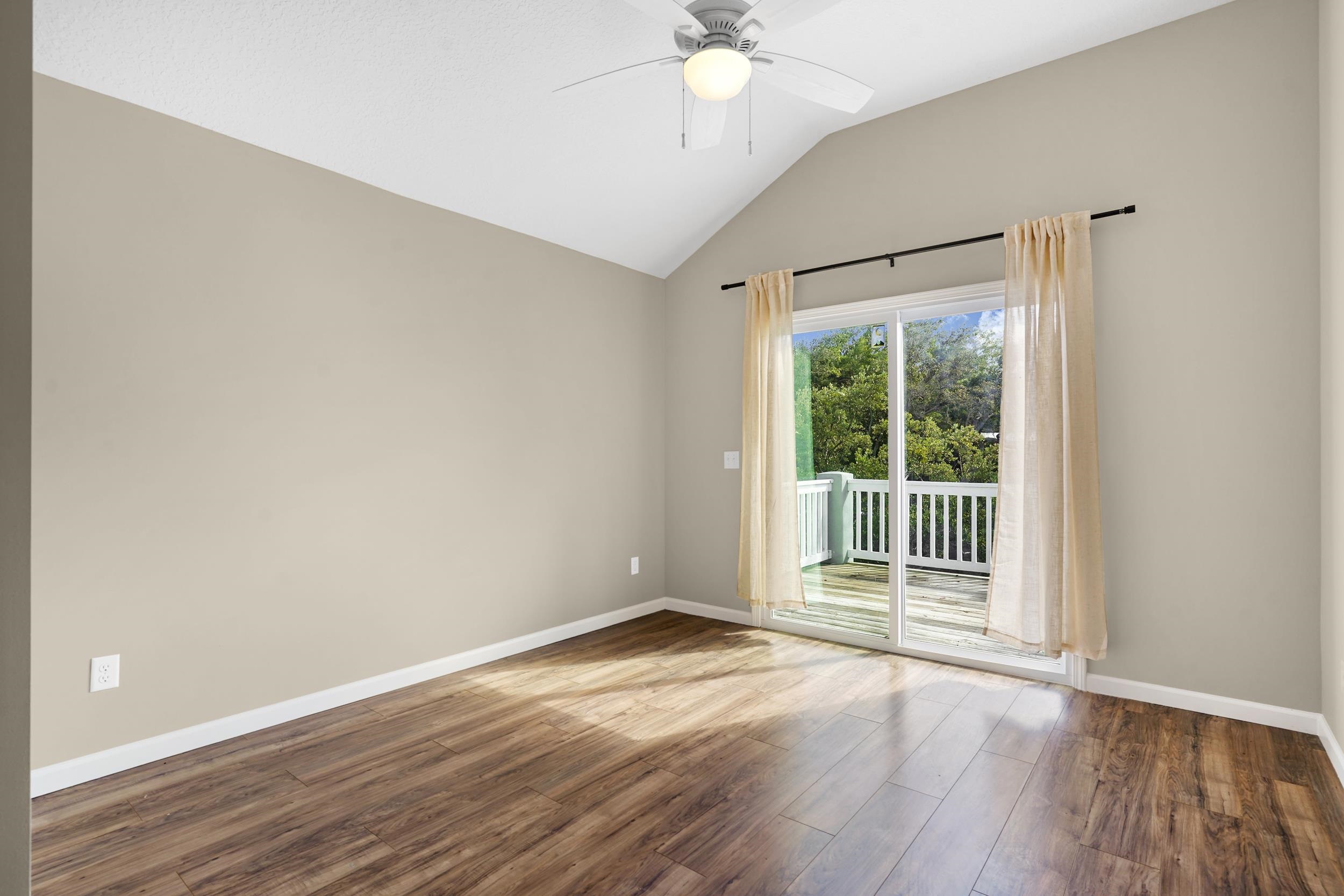 231 Majorca Road St. Augustine, FL 32080 - Photo 15 of 33 a view of an empty room with wooden floor and a window