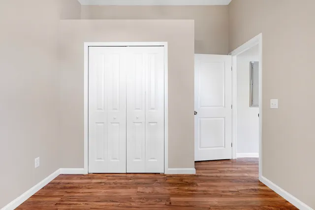 a view of room with hardwood floor