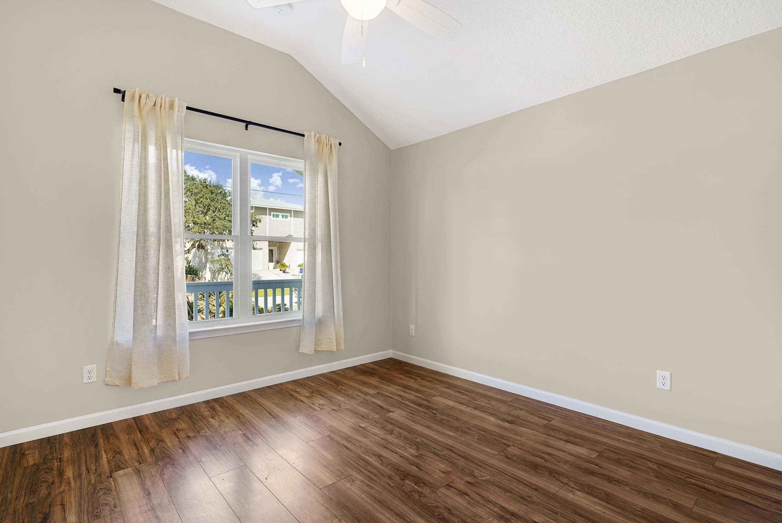 231 Majorca Road St. Augustine, FL 32080 - Photo 17 of 33 an empty room with wooden floor and windows