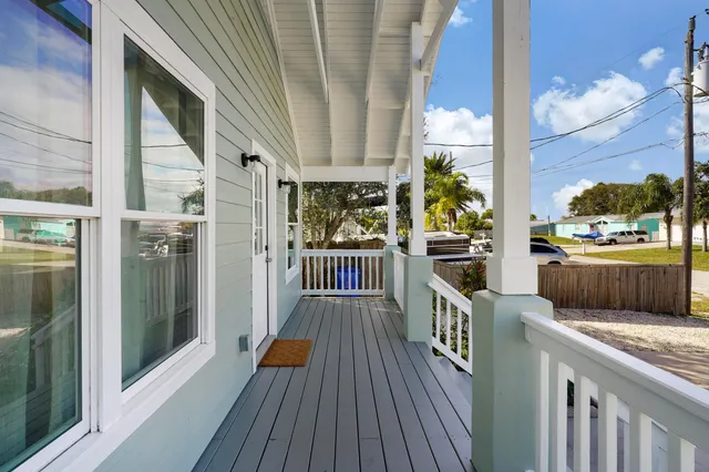 a view of a balcony with wooden floor