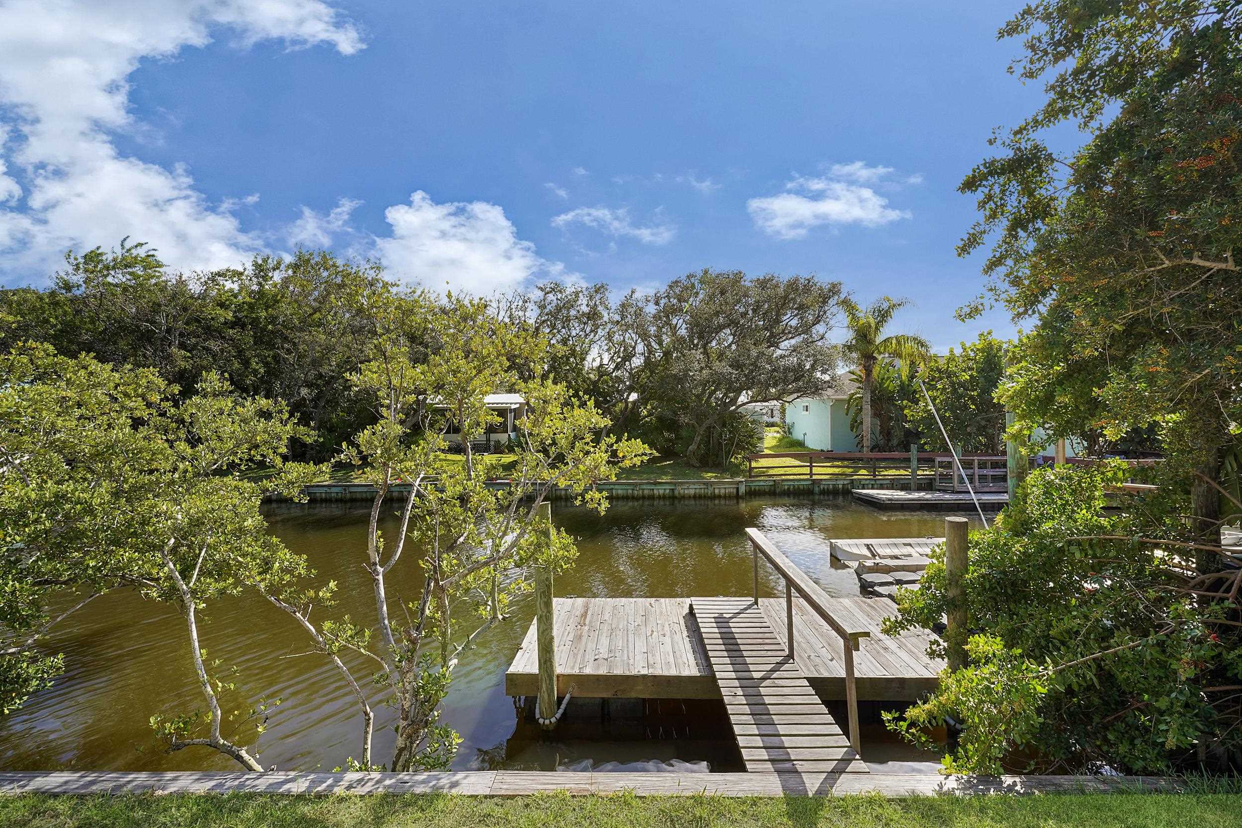 231 Majorca Road St. Augustine, FL 32080 - Photo 21 of 33 a view of a lake with a house in the background