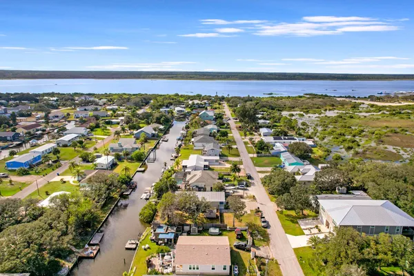 an aerial view of residential building and lake