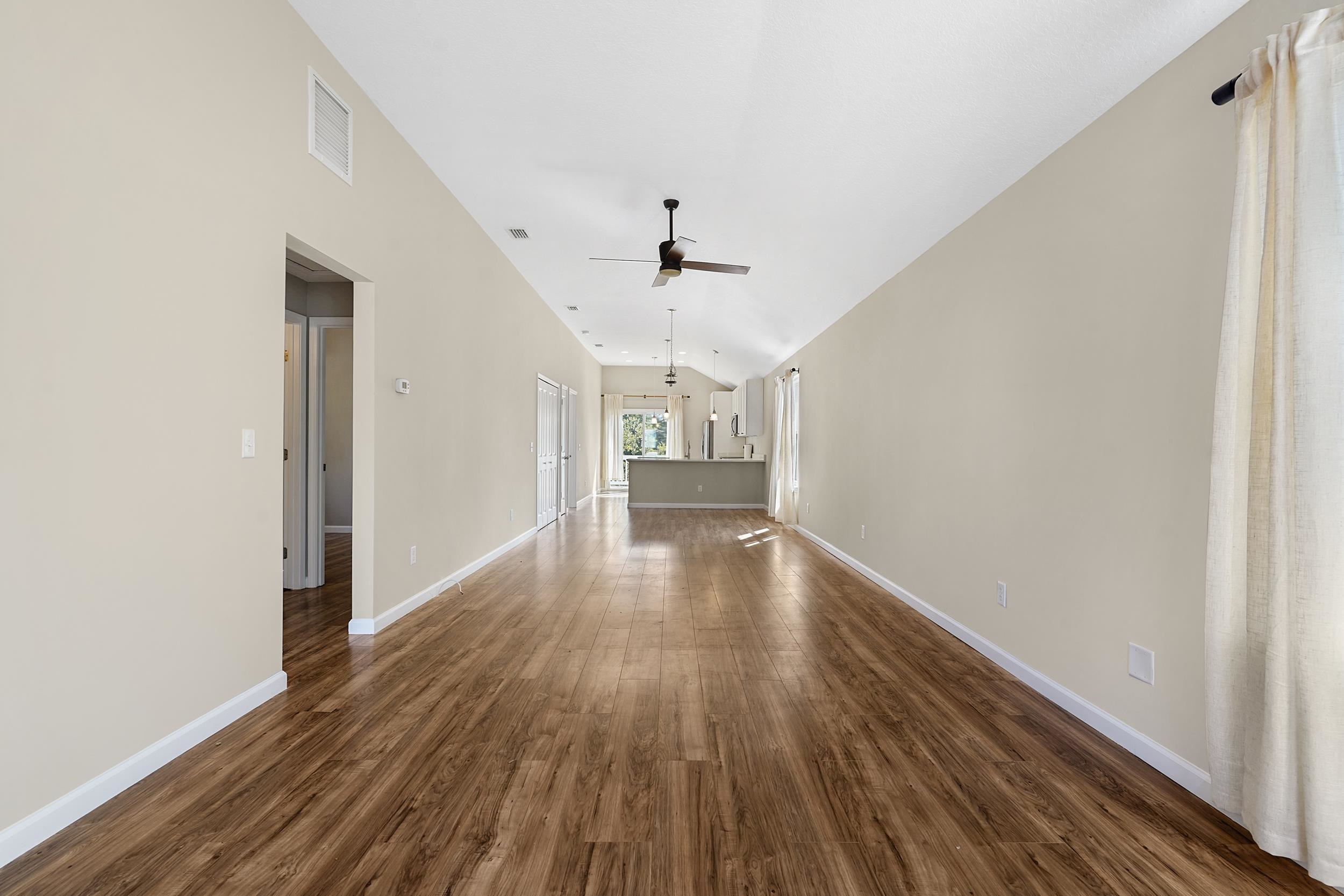 231 Majorca Road St. Augustine, FL 32080 - Photo 4 of 33 a view of an empty room with wooden floor