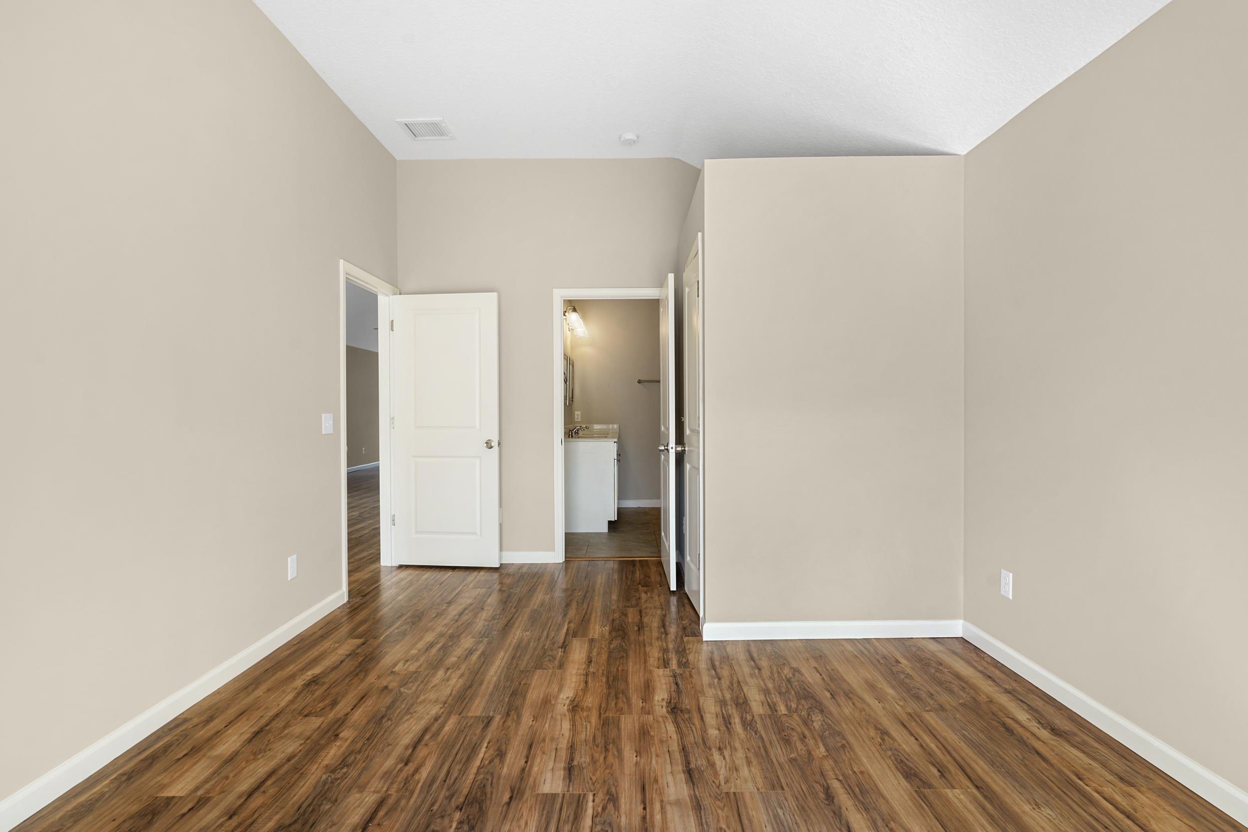 231 Majorca Road St. Augustine, FL 32080 - Photo 10 of 33 a view of a room with wooden floor and a bathroom