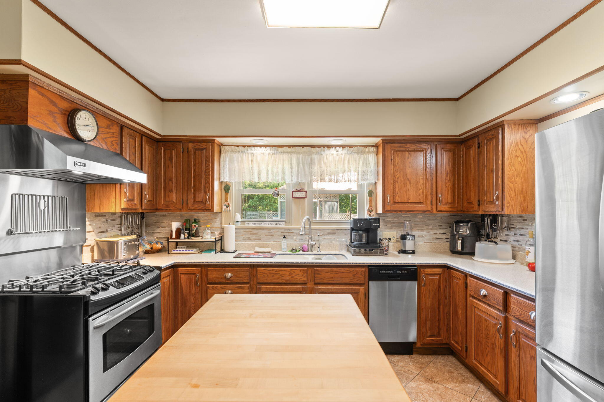 138 McClung Road La Porte, IN 46350 - Photo 11 of 50 a kitchen with a sink stove top oven and cabinets