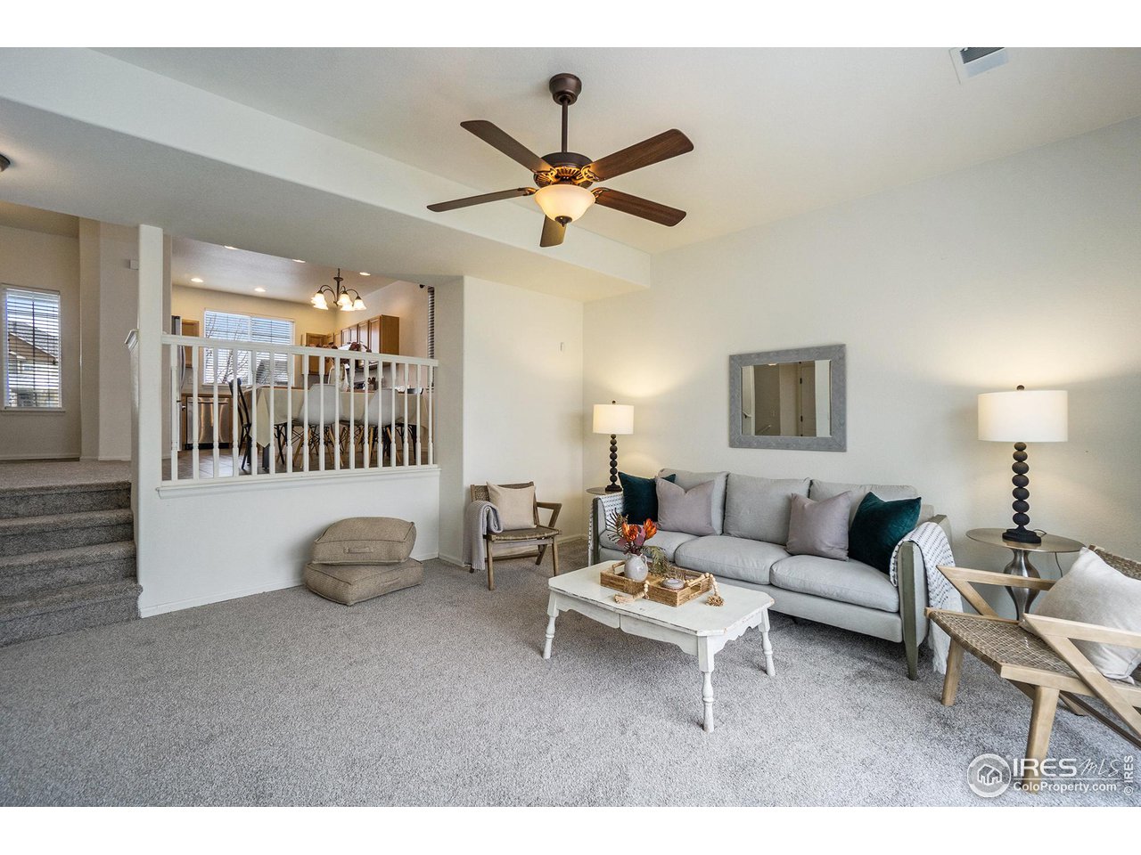 4386 Cypress Ridge Lane Wellington, CO 80549 - Photo 12 of 30 a living room with furniture and a ceiling fan