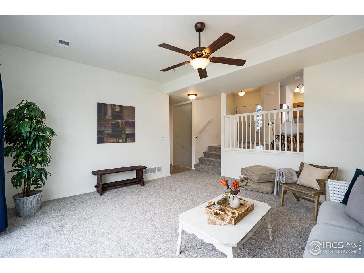 4386 Cypress Ridge Lane Wellington, CO 80549 - Photo 13 of 30 a living room with furniture and a potted plant