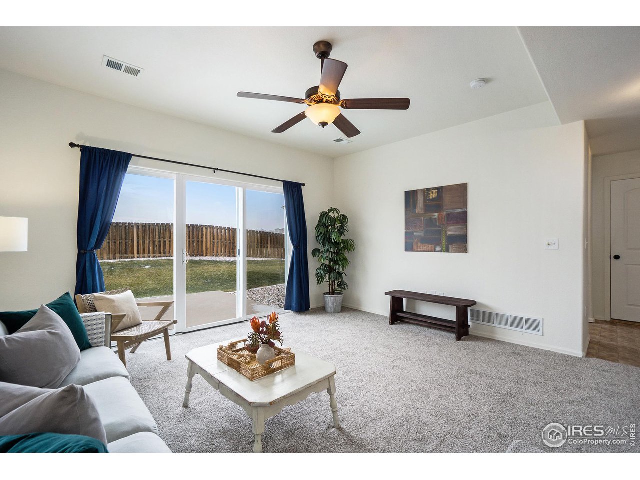 4386 Cypress Ridge Lane Wellington, CO 80549 - Photo 14 of 30 a living room with furniture and a large window