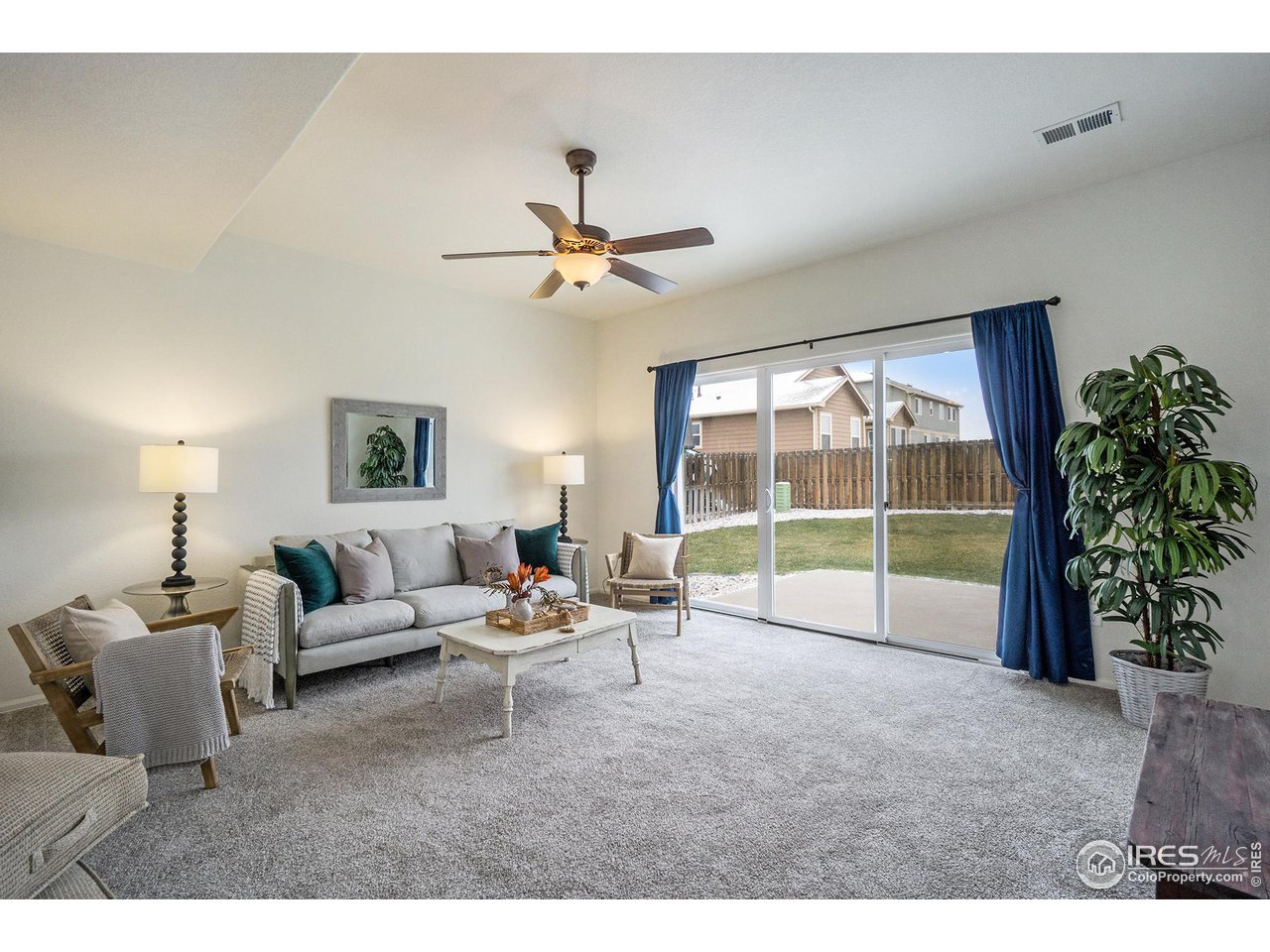 4386 Cypress Ridge Lane Wellington, CO 80549 - Photo 15 of 30 a living room with furniture and a large window