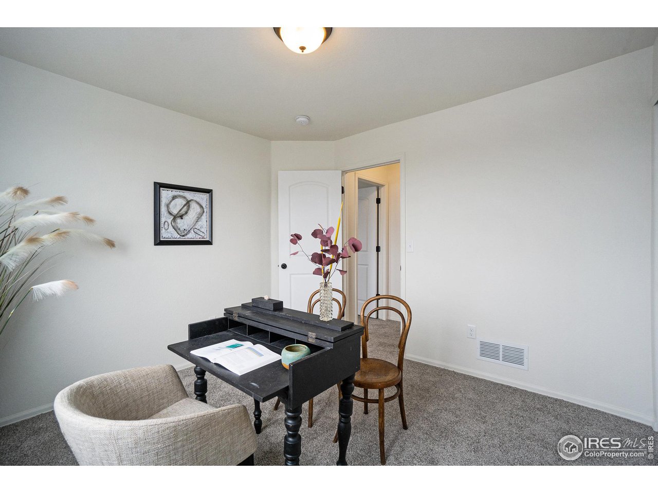 4386 Cypress Ridge Lane Wellington, CO 80549 - Photo 20 of 30 a living room with furniture and a table
