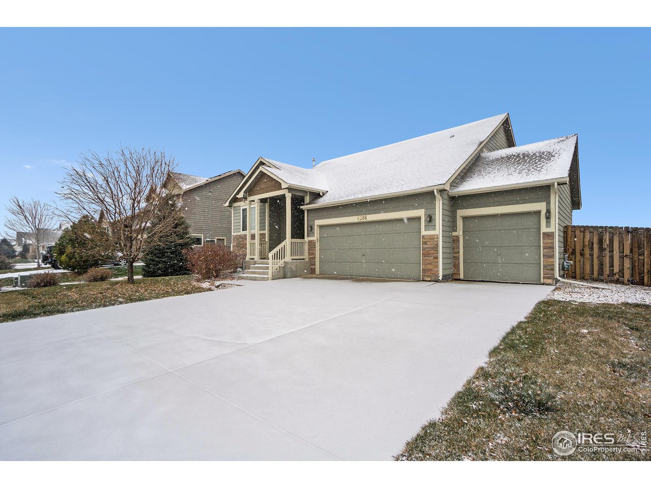 4386 Cypress Ridge Lane Wellington, CO 80549 - Photo 2 of 30 a front view of a house with a yard and garage