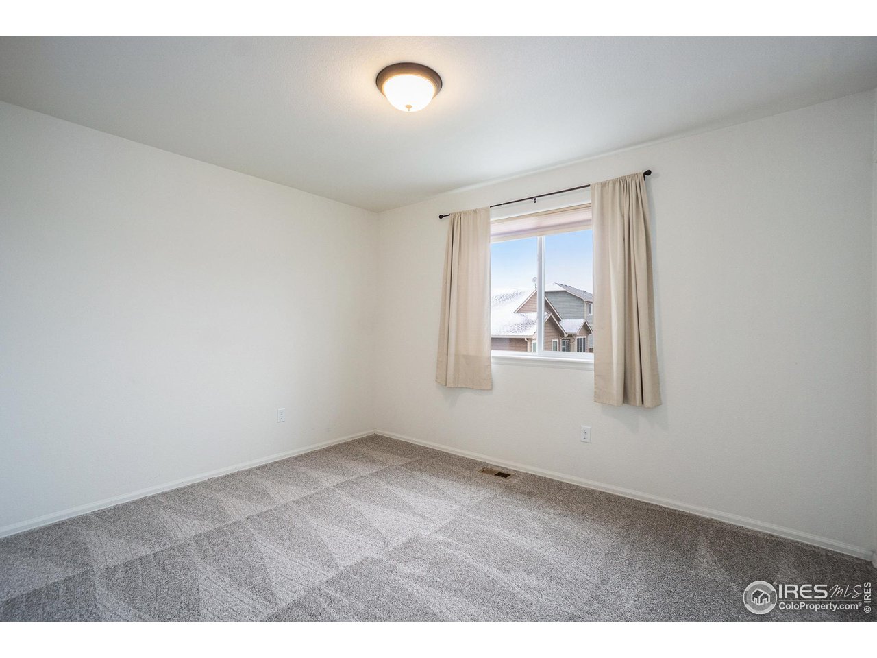 4386 Cypress Ridge Lane Wellington, CO 80549 - Photo 21 of 30 a view of an empty room and window