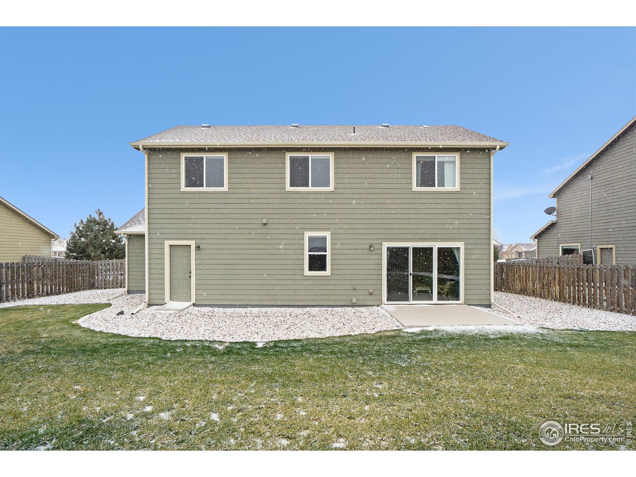 4386 Cypress Ridge Lane Wellington, CO 80549 - Photo 30 of 30 a backyard of a house with table and chairs