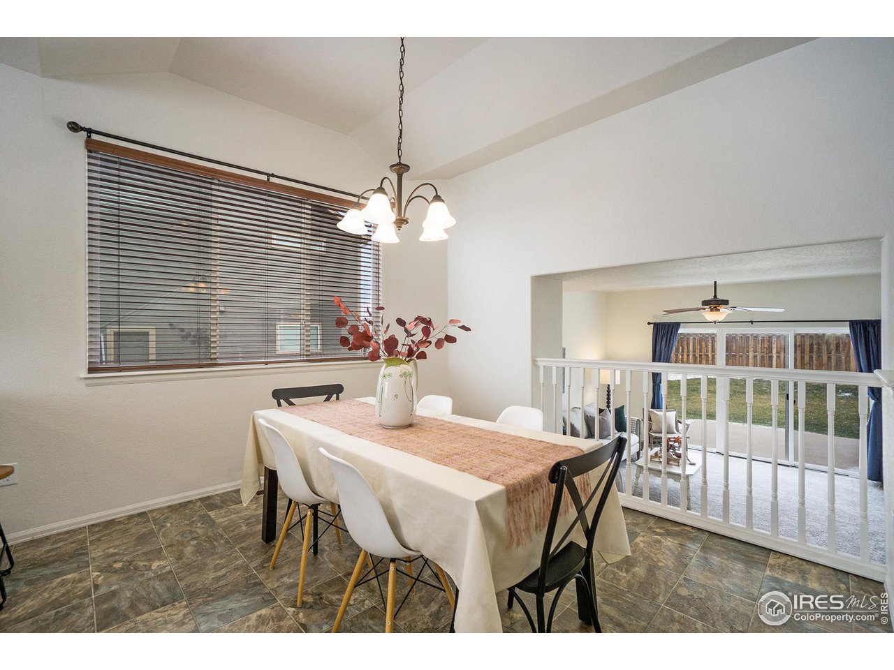 4386 Cypress Ridge Lane Wellington, CO 80549 - Photo 10 of 30 a dining room with furniture and window
