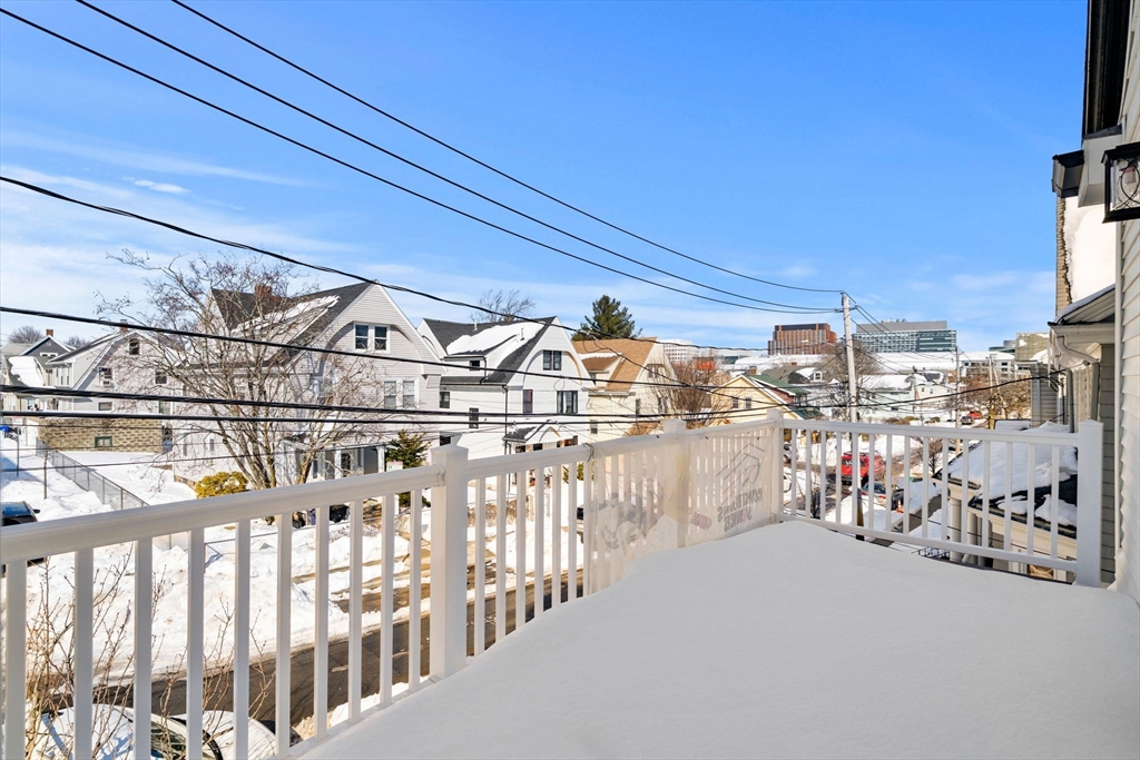 53 Dustin Street, Unit 2 Boston, MA 02135 - Photo 16 of 21 a view of a city from a balcony